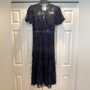 Stunning navy lace Self Portrait dress. Lined except for peekaboo under bust.